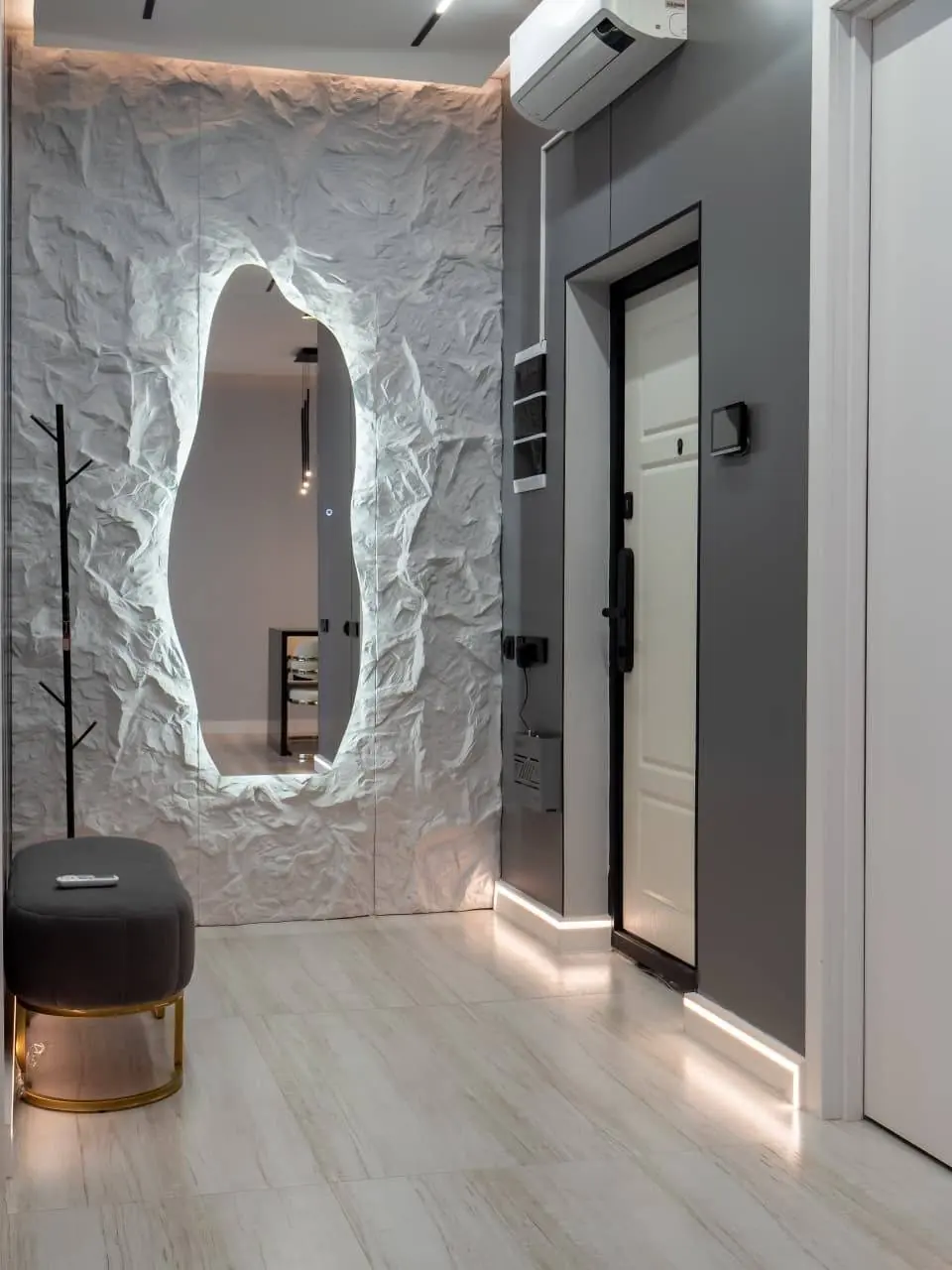 Sculpted mirror in entrance hall