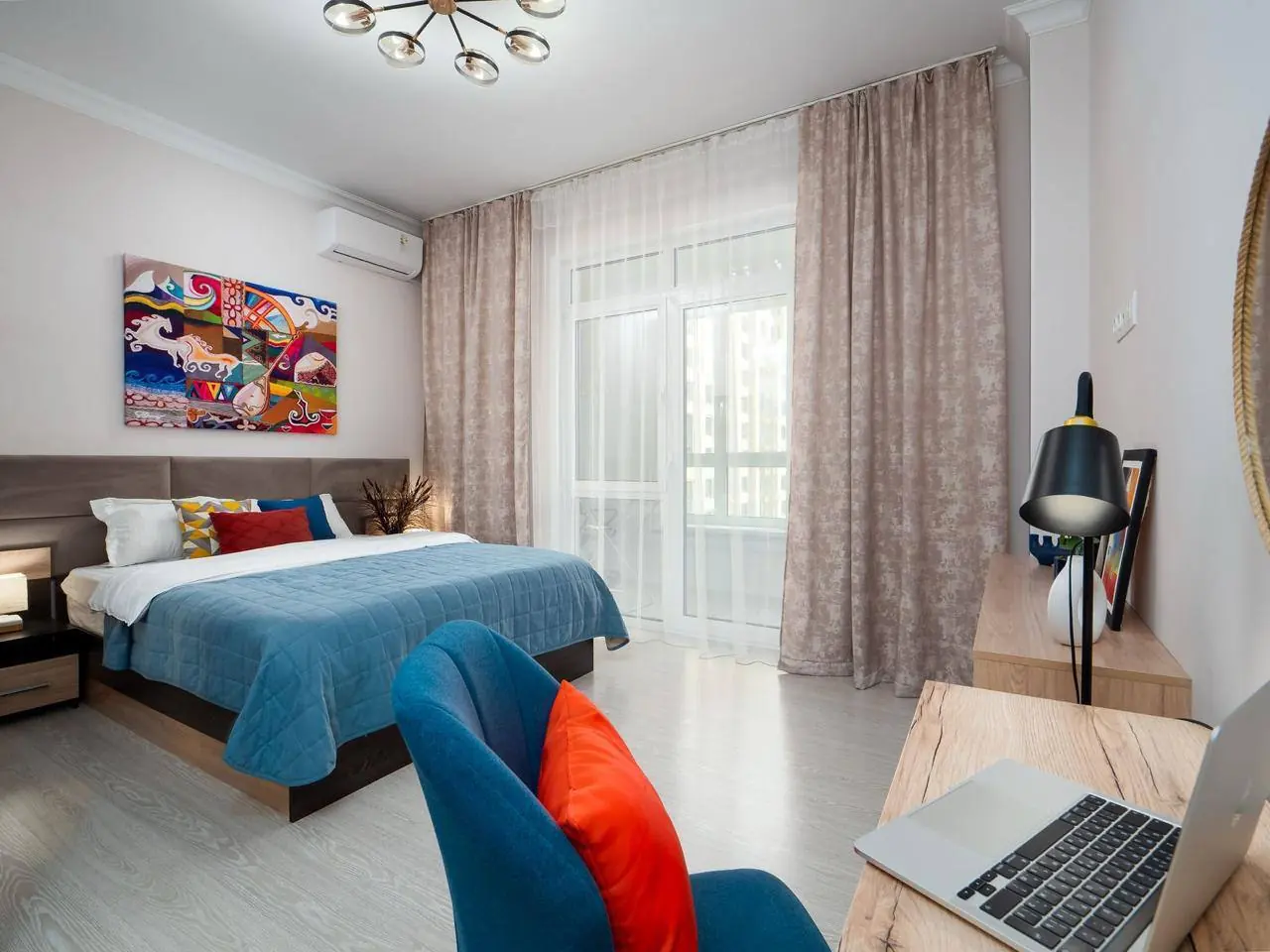 Bright bedroom with workspace